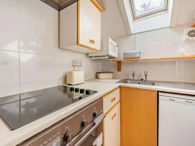 a small kitchen with a stove and a sink at 1 Bed in Penrith oc-sz295 in Dockray