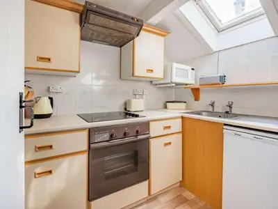 a kitchen with a stove and a sink and a window at 1 Bed in Penrith oc-sz295 in Dockray