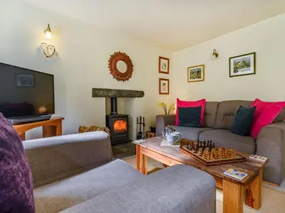 a living room with a couch and a chess board at 3 Bed in Keswick oc-sz065 in Applethwaite