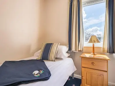 a small bedroom with a bed and a window at 3 Bed in Keswick SZ547 in Keswick