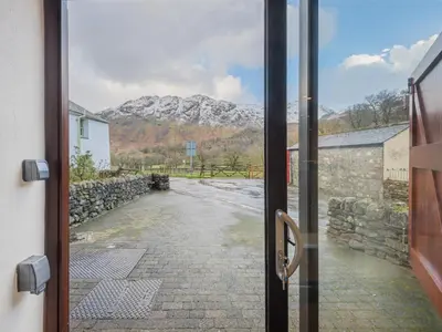 an open door with a view of a mountain at 3 Bed in Borrowdale SZ465 in Rosthwaite