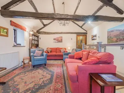 a living room with two couches and a table at 3 Bed in Borrowdale SZ465 in Rosthwaite