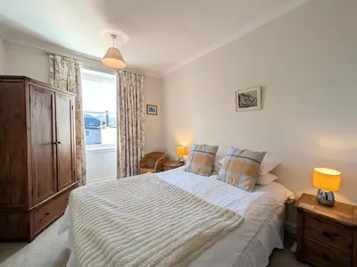 a bedroom with a large bed and a window at 3 Bed in Keswick SZ187 in Keswick