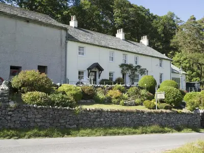 a large white house with a stone wall at 3 Bed in Newlands Valley SZ075 in Borrowdale Valley