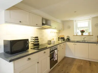 a kitchen with white cabinets and a microwave at 3 Bed in Newlands Valley SZ075 in Borrowdale Valley