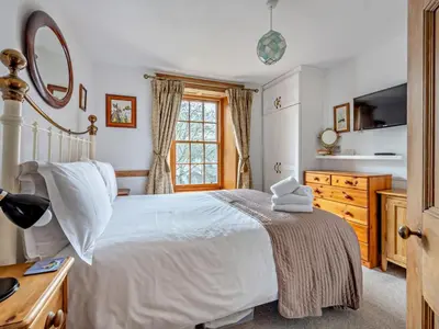 a bedroom with a white bed and a window at 1 Bed in Keswick SZ472 in Keswick