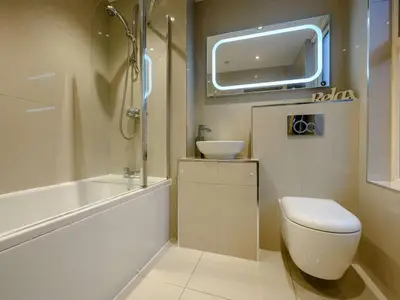 a bathroom with a toilet and a sink and a shower at 2 Bed in Keswick oc-sz036 in Keswick