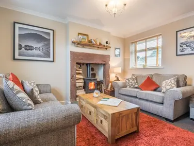 a living room with two couches and a fireplace at 3 Bed in Gosforth oc-sz064 in Gosforth