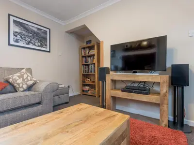 a living room with a couch and a flat screen tv at 3 Bed in Gosforth oc-sz064 in Gosforth