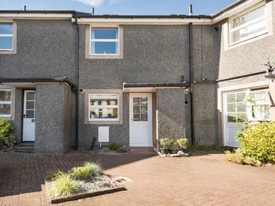 an exterior view of a house with white doors at 2 Bed in Keswick SZ462 in Keswick