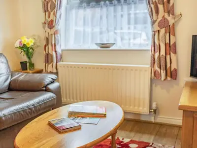 a living room with a coffee table and a window at 2 Bed in Keswick SZ462 in Keswick
