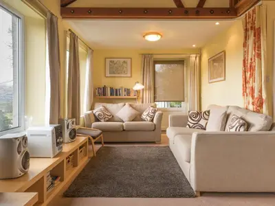 a living room with two couches and a tv at 3 Bed in Applethwaite SZ540 in Applethwaite