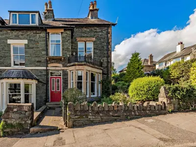 an old brick house with a red door at 4 Bed in Keswick SZ292 in Keswick