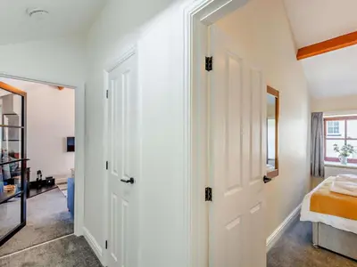 a bedroom with a white door and a bed at 2 Bed in Keswick oc-sz449 in Keswick