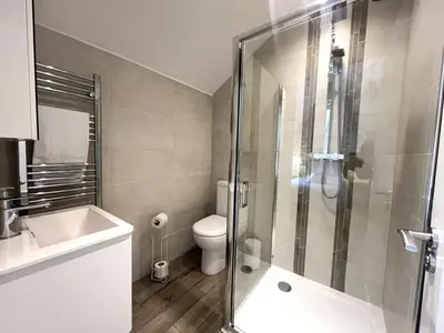 a bathroom with a toilet and a glass shower at 2 Bed in Keswick SZ379 in Keswick