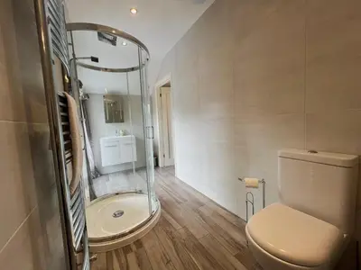 a bathroom with a toilet and a shower in it at 2 Bed in Keswick SZ379 in Keswick