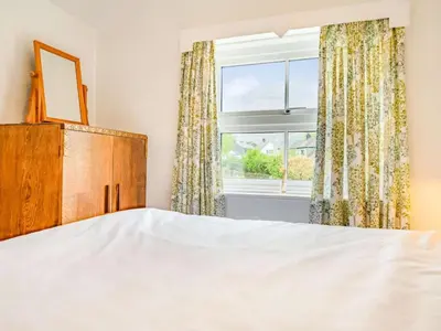 a bedroom with a bed and a window at 2 Bed in Borrowdale SZ302 in Rosthwaite