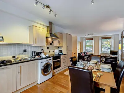 a kitchen with a table and a dining room at 2 Bed in Keswick oc-sz132 in Keswick