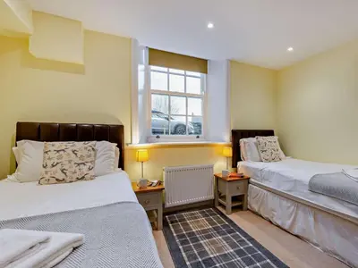 a room with two beds and a window at 2 Bed in Keswick oc-sz132 in Keswick