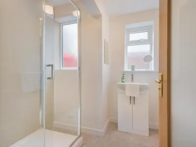 a bathroom with a shower and a sink at 3 Bed in Keswick oc-sz283 in Keswick