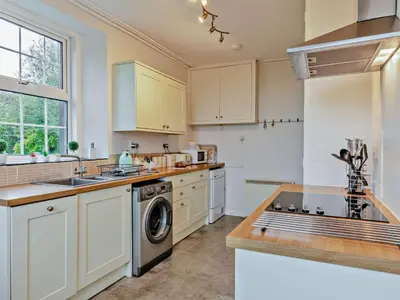 a kitchen with white cabinets and a dishwasher at 2 Bed in Wasdale oc-sz077 in Santon Bridge