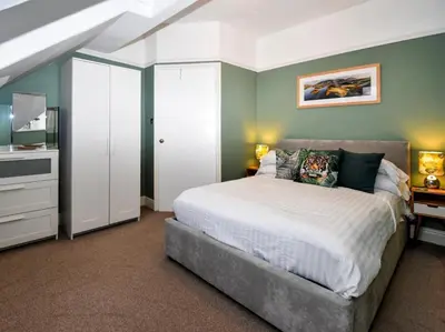 a bedroom with a white bed and a white closet at 3 Bed in Keswick oc-sz118 in Keswick