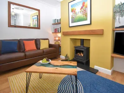 a living room with a couch and a fireplace at 3 Bed in Keswick oc-sz118 in Keswick