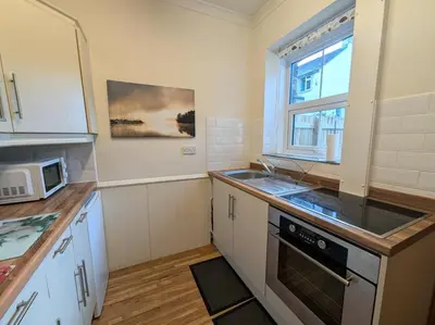 a kitchen with a sink and a microwave at 2 Bed in Keswick oc-sz417 in Keswick