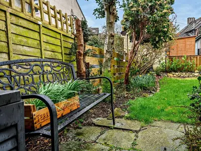 a bench in a garden next to a fence at 2 Bed in Keswick oc-sz417 in Keswick
