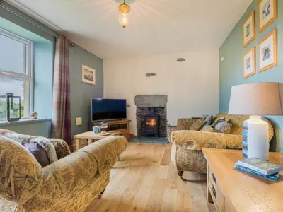 a living room with two couches and a fireplace at 3 Bed in Keswick oc-sz227 in Threlkeld