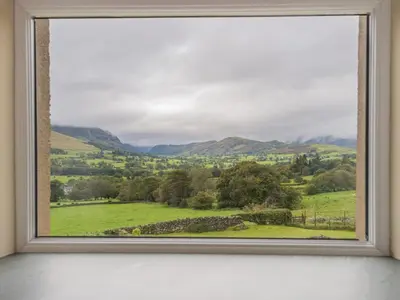 a window with a view of a green field at 3 Bed in Keswick oc-sz227 in Threlkeld