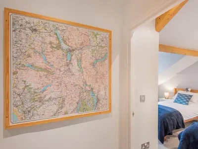 a large map hanging on a wall in a bedroom at 2 Bed in Keswick SZ494 in Keswick