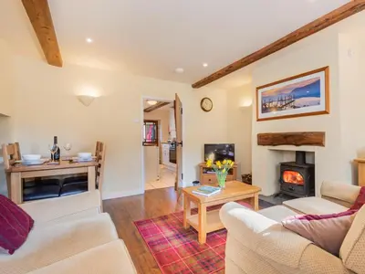 a living room with two couches and a fireplace at 2 Bed in Keswick oc-sz378 in Portinscale