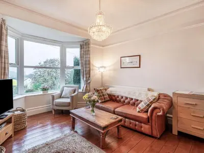 a living room with a couch and a table at 2 Bed in Holmrook oc-sz464 in Beckfoot