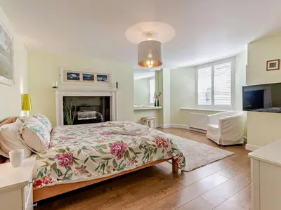 a bedroom with a bed and a fireplace at 1 Bed in Keswick SZ127 in Keswick