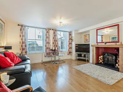 a living room with a couch and a fireplace at 1 Bed in Keswick SZ127 in Keswick