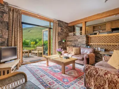 a living room with a couch and a tv at 2 Bed in Penrith oc-sz092 in Mosedale