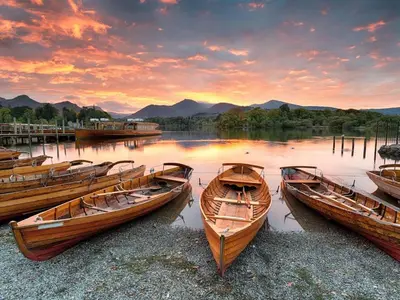 three boats on the shore of a lake at sunset at 3 Bed in Keswick oc-sz029 in Keswick