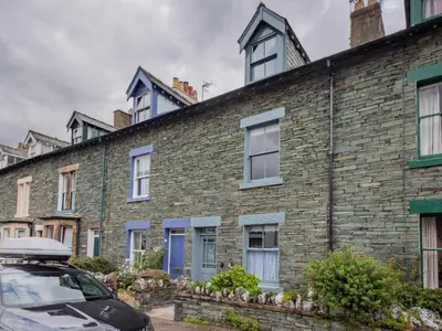 a row of brick houses with blue windows at 3 Bed in Keswick oc-sz029 in Keswick