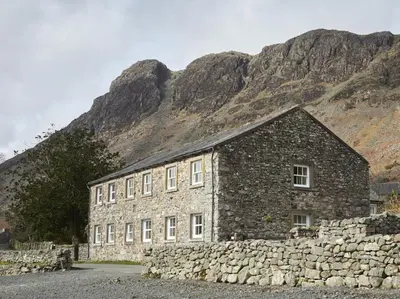 a stone building in front of a mountain at 2 Bed in Wasdale Head oc-sz551 in Nether Wasdale