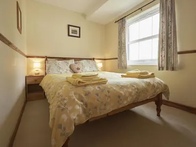 a bedroom with a bed with towels on it at 2 Bed in Wasdale Head oc-sz551 in Nether Wasdale