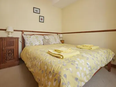 a bedroom with a bed with yellow towels on it at 2 Bed in Wasdale Head oc-sz551 in Nether Wasdale