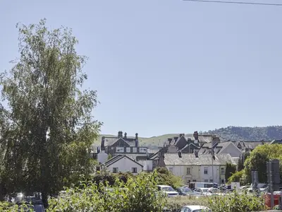 a group of houses in a town with cars at 2 Bed in Keswick SZ011 in Keswick