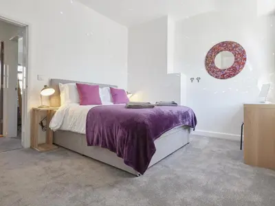 a bedroom with a bed with a purple blanket at 2 Bed in Keswick SZ011 in Keswick