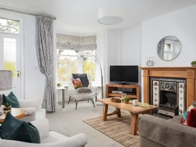 a living room with a fireplace and a tv at 3 Bed in Keswick oc-sz337 in Keswick
