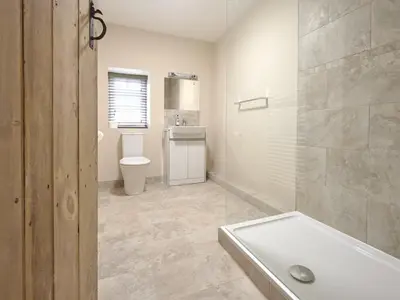 a bathroom with a tub and a toilet and a sink at 3 Bed in Keswick oc-sz169 in Applethwaite