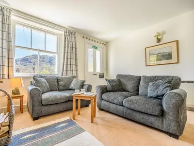 a living room with two couches and a table at 3 Bed in Borrowdale SZ234 in Rosthwaite