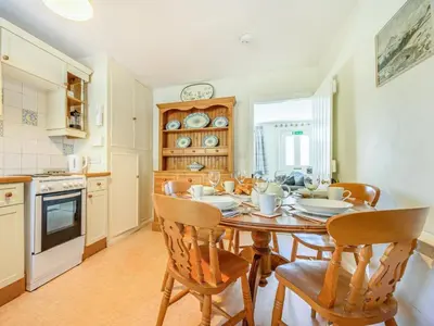 a kitchen and dining room with a table and chairs at 3 Bed in Borrowdale SZ234 in Rosthwaite
