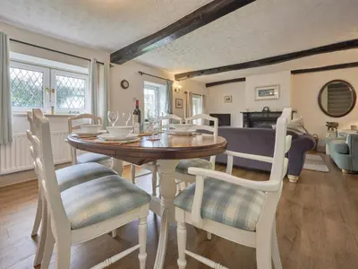 a dining room with a table and chairs at 2 Bed in Workington oc-sz323 in Camerton