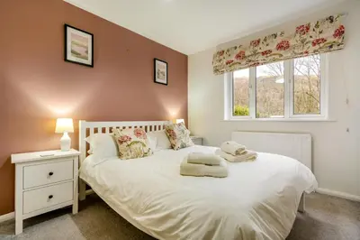 a bedroom with a white bed and a window at 3 Bed in Keswick oc-84638 in Keswick